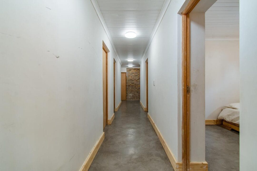 Kana Huis 4-11 House 4, Kana Guest Farm – self-catering group stay in Stellenbosch with modern kitchen, lounge, pool & jacuzzi access.