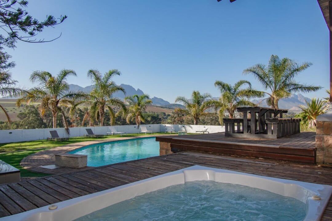 Kana Huis 4-5 House 4, Kana Guest Farm – self-catering group stay in Stellenbosch with modern kitchen, lounge, pool & jacuzzi access.
